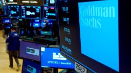 FILE - The logo for Goldman Sachs appears above a trading post on the floor of the New York Stock Exchange, Tuesday, July 13, 2021.  Goldman Sachs' said, Tuesday, Jan. 18, 2022, its fourth-quarter profits fell by 13% from a year earlier, largely due to the bank preparing to pay out hefty pay packages to its well-compensated employees. It's the latest sign that wages are increasing sharply, particularly on Wall Street.   (AP Photo/Richard Drew)