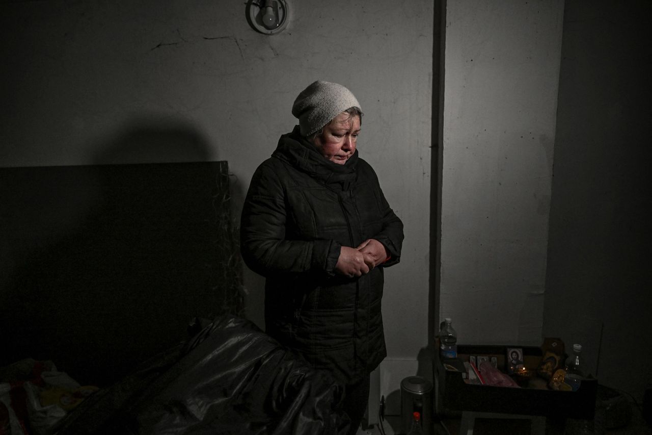 A resident takes shelter in a basement in Irpin on March 10. <a target=