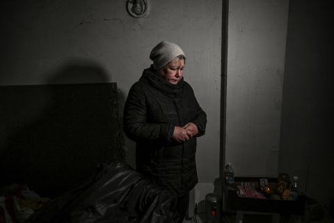 A resident takes shelter in a basement in Irpin on March 10. Due to heavy fighting, Irpin has been without heat, water or electricity for several days.