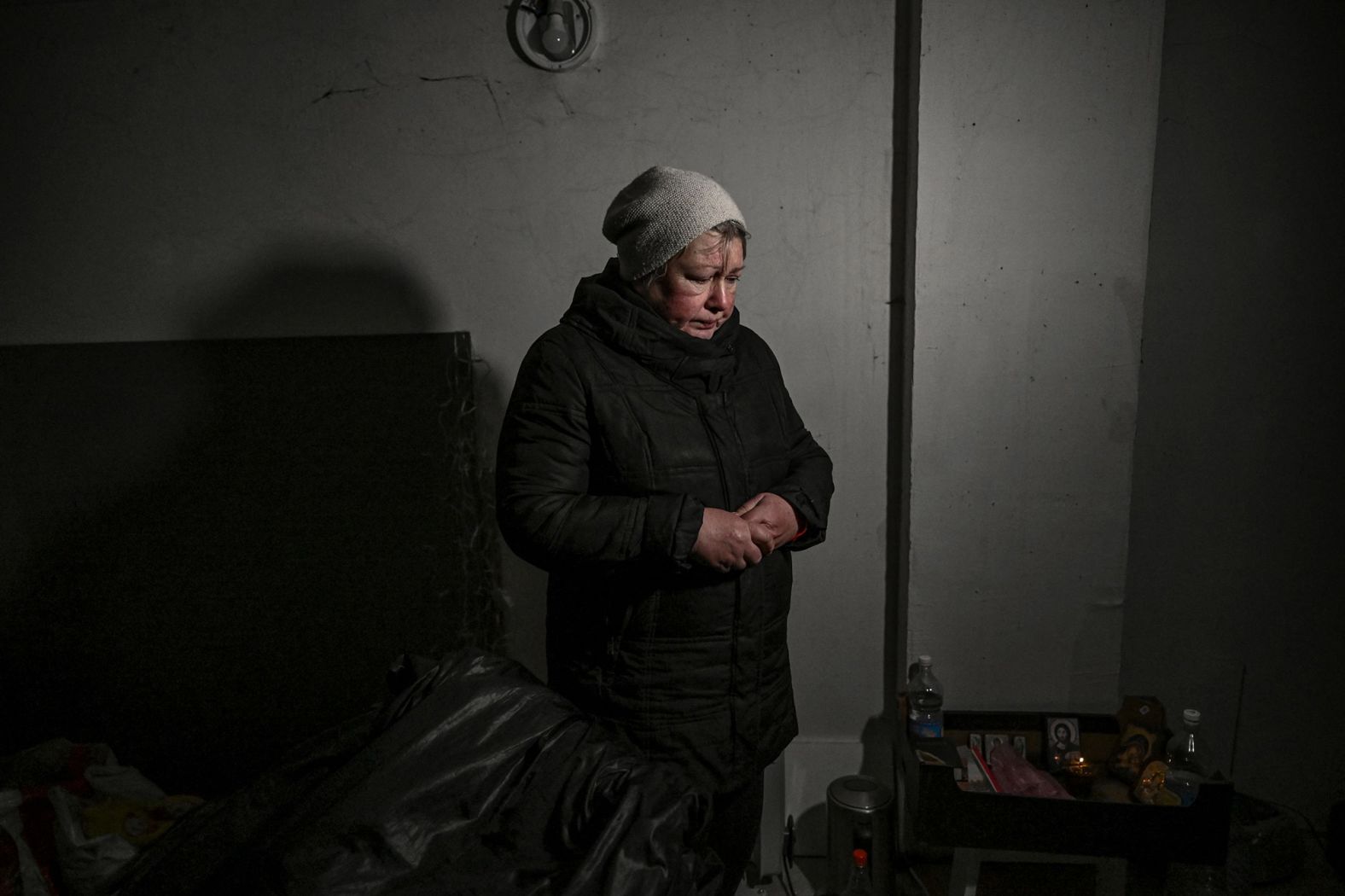 A resident takes shelter in a basement in Irpin on March 10. <a href="index.php?page=&url=https%3A%2F%2Fwww.cnn.com%2Feurope%2Flive-news%2Fukraine-russia-putin-news-03-08-22%2Fh_e09d49888fcb2a07b8f1a95d6f2b0faa" target="_blank">Due to heavy fighting,</a> Irpin has been without heat, water or electricity for several days.
