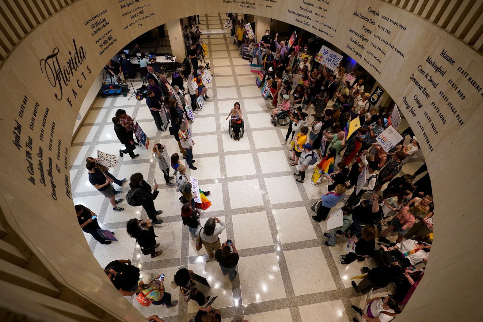 People protest inside the Florida State Capitol on Monday, March 7. They were rallying against legislation that would ban school districts in the state from encouraging classroom discussions related to sexual orientation and gender identity. Opponents have been calling it the "Don't Say Gay" bill, and <a href="index.php?page=&url=https%3A%2F%2Fwww.cnn.com%2F2022%2F03%2F08%2Fus%2Fdont-say-gay-gen-z-resistance-florida-cec%2Findex.html" target="_blank">it is poised to become law</a> after the state Senate voted to pass the measure on Tuesday.