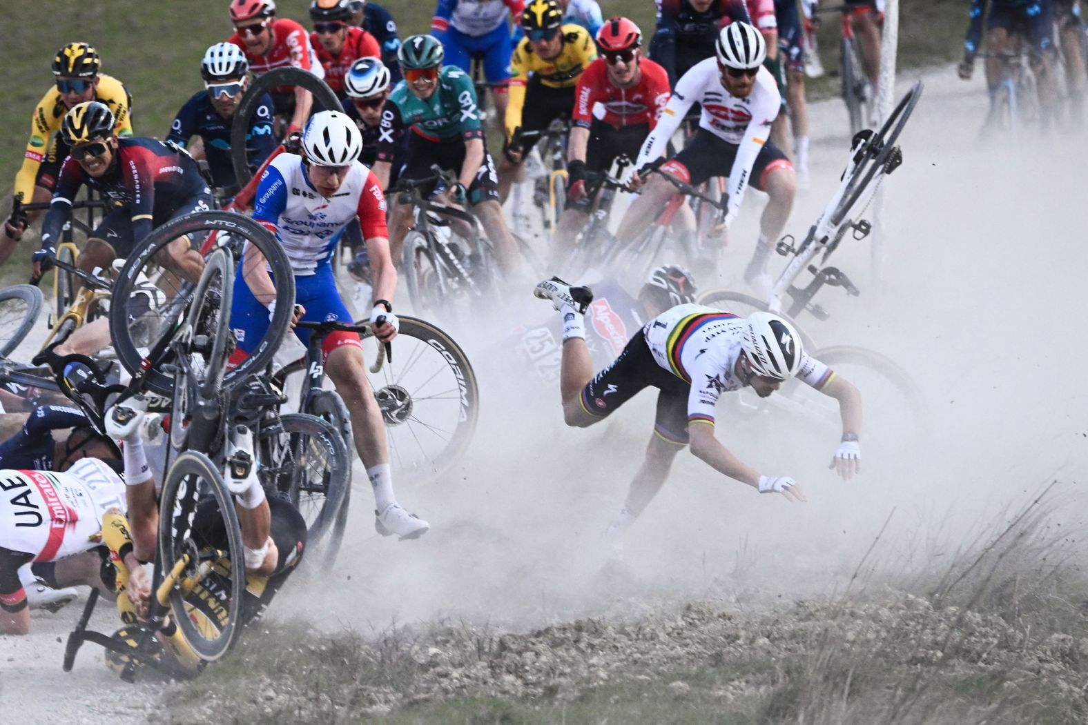 French cyclist Julian Alaphilippe, bottom right, falls during a crash in the Strade Bianche race in Italy on Saturday, March 5. He would go on to finish the race.