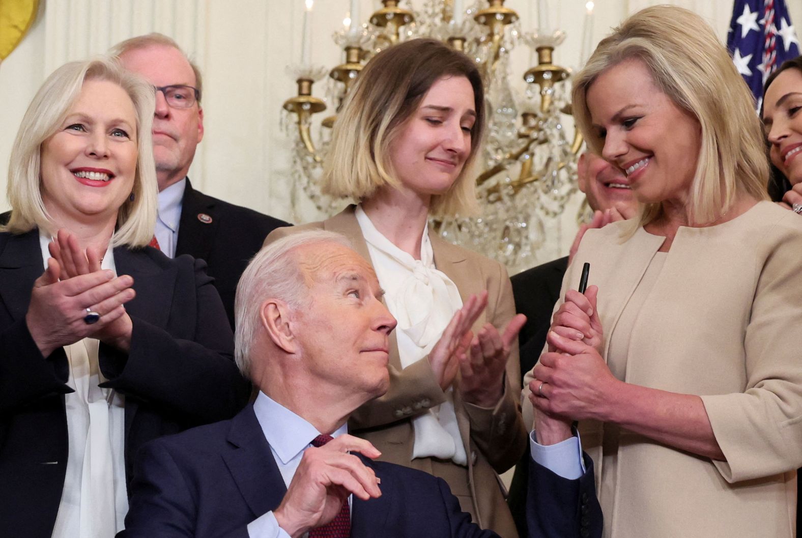 US President Joe Biden shakes hands with former Fox News anchorwoman Gretchen Carlson after he signed into law sweeping workplace reforms on Thursday, March 3. <a href="index.php?page=&url=https%3A%2F%2Fwww.cnn.com%2F2022%2F03%2F03%2Fpolitics%2Fbiden-sexual-misconduct-bill-signing%2Findex.html" target="_blank">The legislation</a> ends the use of forced arbitration clauses specifically for sexual harassment and sexual assault claims, allowing victims the option of bringing up the dispute in federal, tribal or state court.