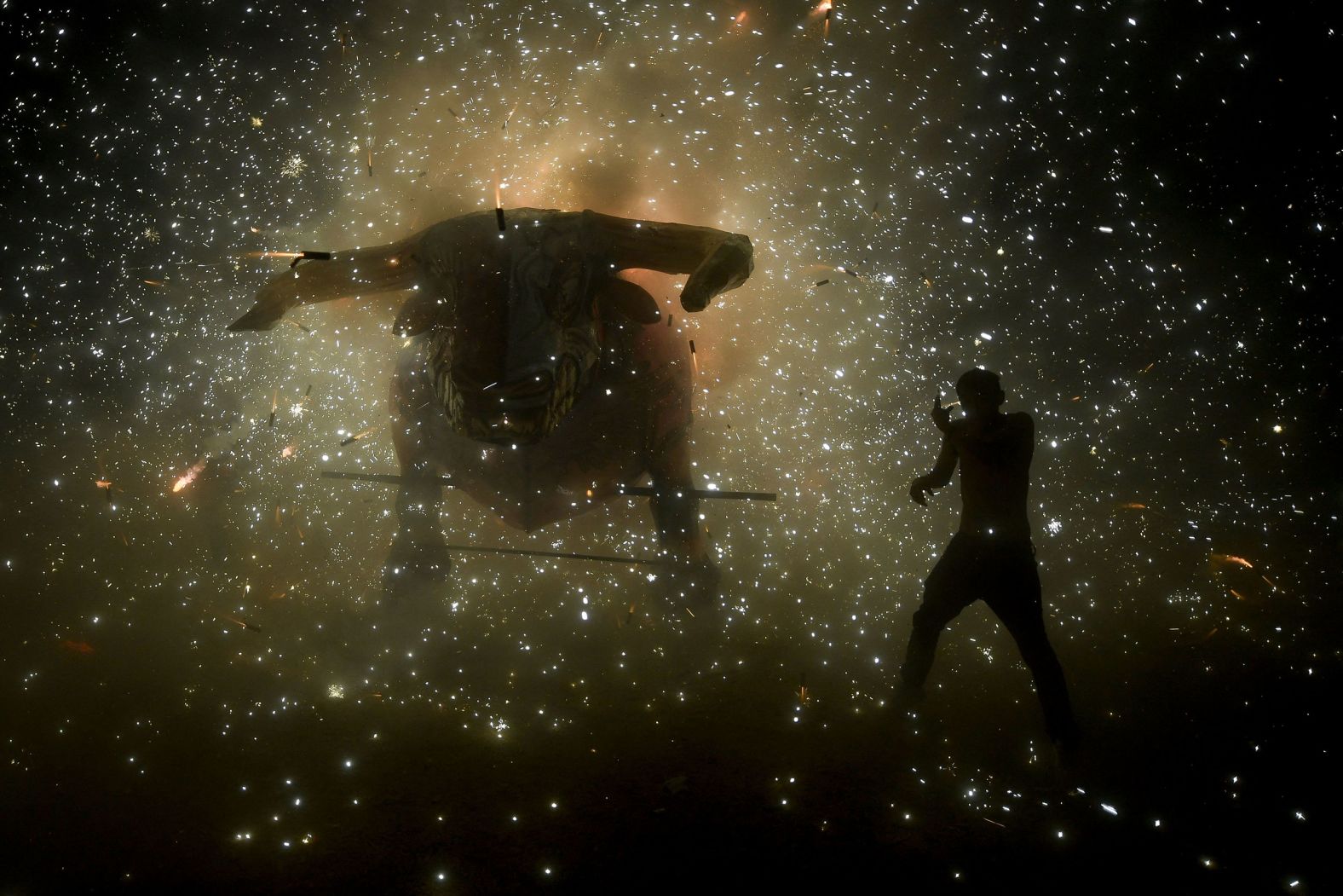 Fireworks explode from a bull figure during a San Juan de Dios celebration in Tultepec, Mexico, on Wednesday, March 8.