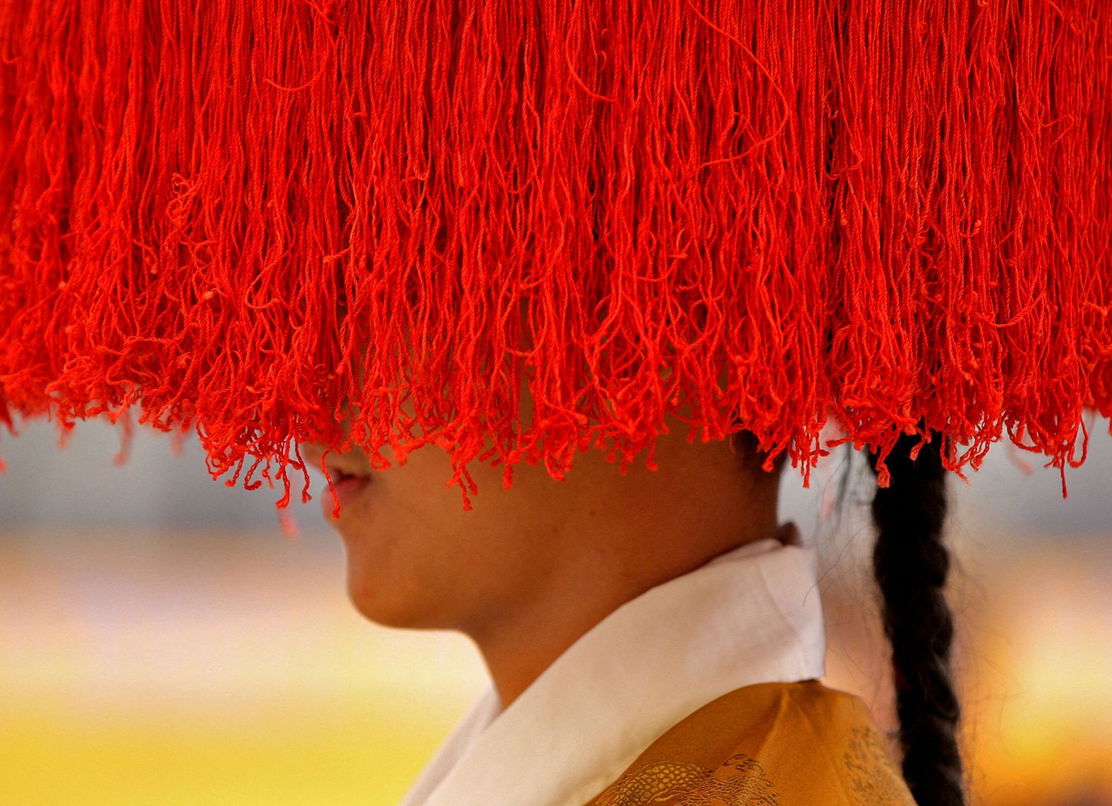 A Tibetan wears traditional headgear during a function marking the Tibetan New Year in Kathmandu, Nepal, on Saturday, March 5.