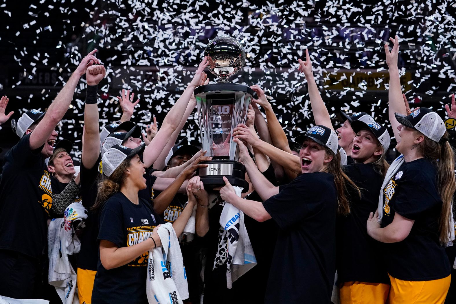 The women's basketball team from the University of Iowa celebrates after winning the Big Ten Tournament on Sunday, March 6.