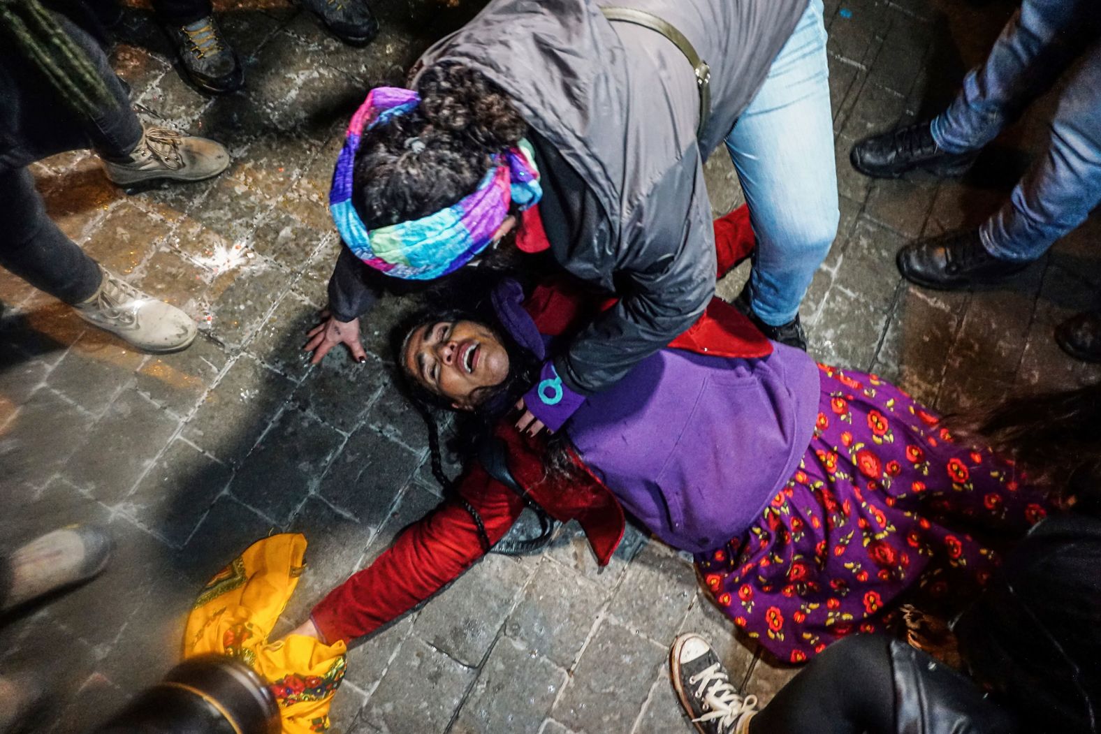 A demonstrator faints after being pepper-sprayed by police during an International Women's Day rally in Istanbul on Tuesday, March 8. <a href="index.php?page=&url=https%3A%2F%2Fwww.reuters.com%2Fworld%2Fmiddle-east%2Fturkish-police-clash-with-crowd-gathering-mark-womens-day-2022-03-08%2F" target="_blank" target="_blank">According to the Reuters news agency,</a> the Istanbul Governor's office had said that it would not allow marches, protests or press statements to mark the event around Taksim Square.