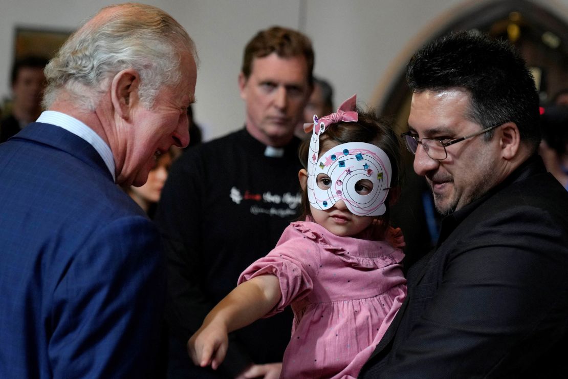 Charles meets refugees during the visit on Wednesday. 