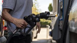 A driver returns a fuel nozzle to a gas pump at a Chevron gas station in San Francisco, California, U.S., on Monday, March 7, 2022. The average price of gasoline in the U.S. jumped above $4 a gallon for the first time since 2008 in a clear sign of the energy inflation that's hurt consumers since Russia invaded Ukraine. Photographer: David Paul Morris/Bloomberg via Getty Images