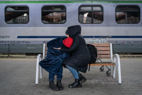 A displaced Ukrainian mother embraces her child while waiting at the Przemysl railway station in Poland on March 8.
