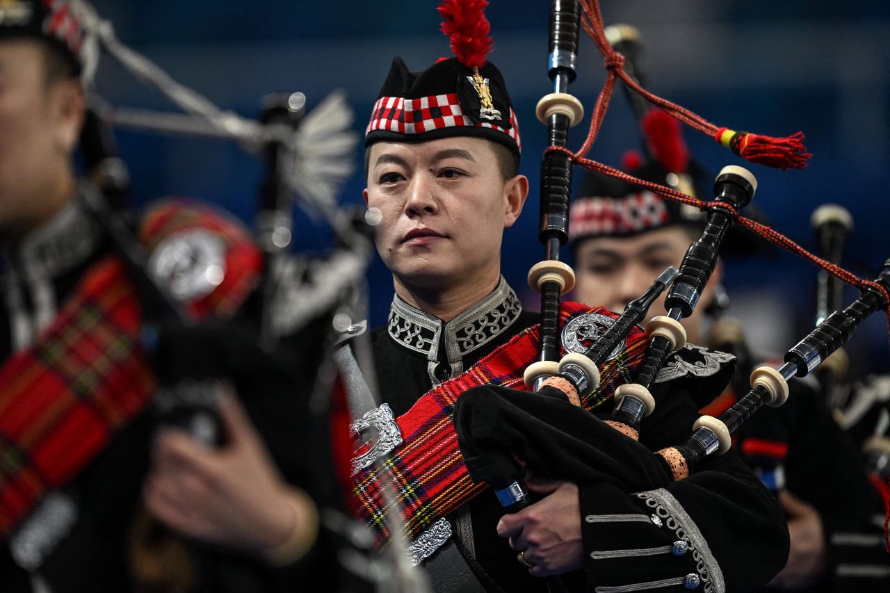 The Beijing Military Pipe Band performs before a curling event on Thursday, March 10.
