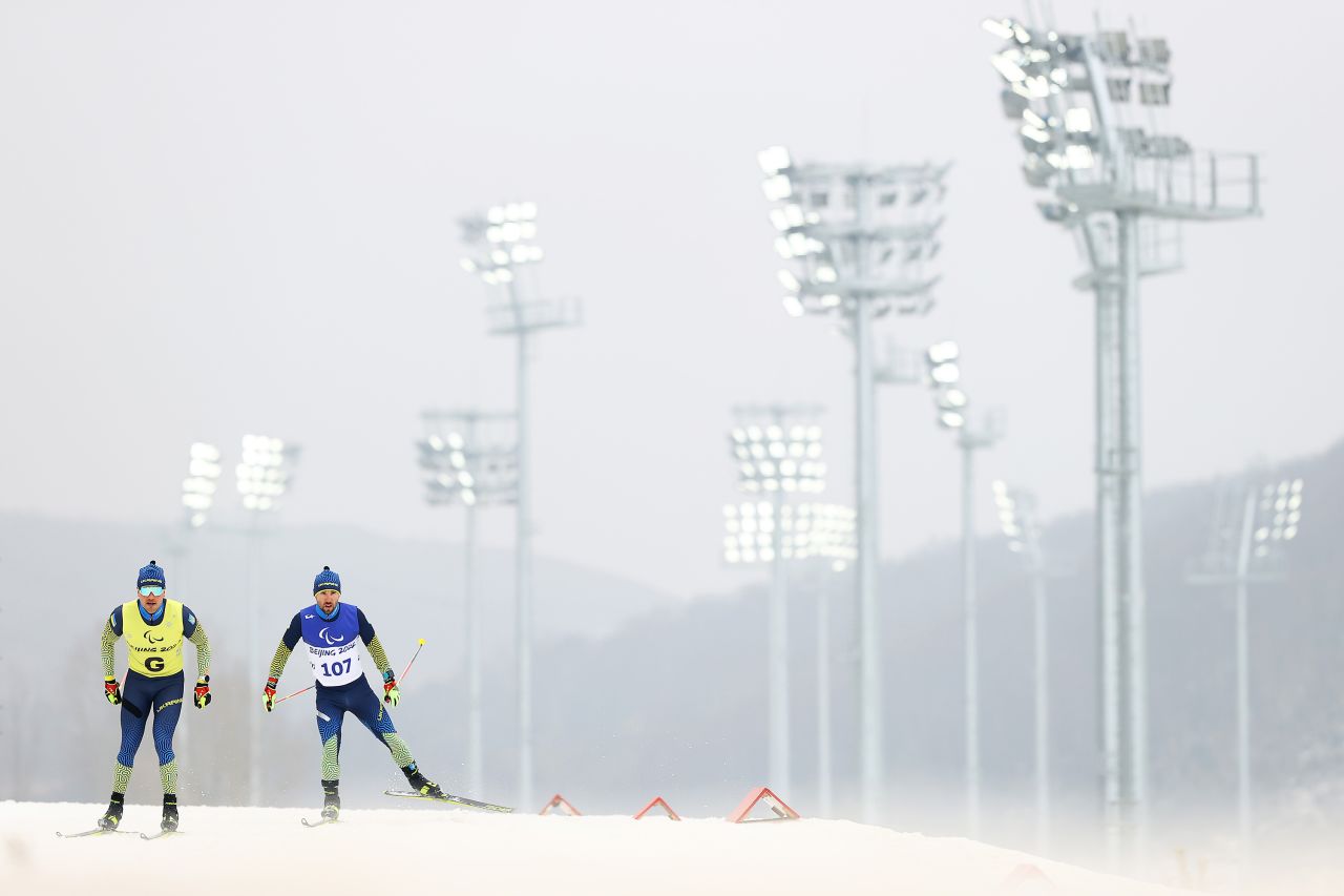 Ukraine's Anatolii Kovalevskyi and his guide, Oleksandr Mukshyn, compete in a biathlon event on March 11.