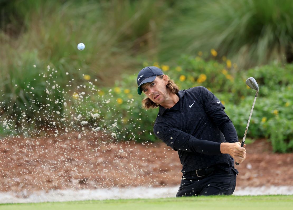 Fleetwood plays his third shot on the par four, 14th hole during the first round of the Players Championship.