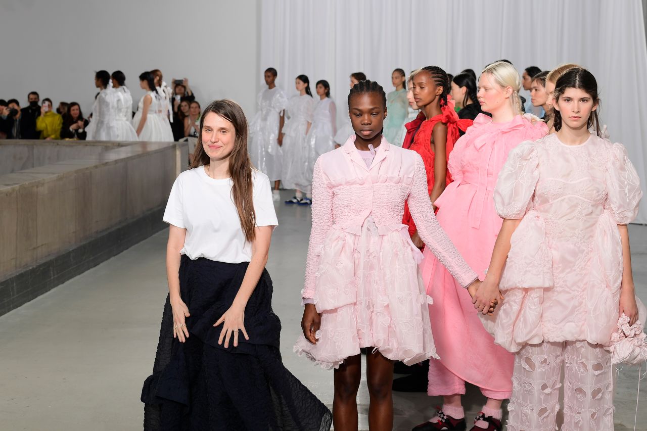 Danish designer Cecilie Bahnsen stands with models at her Paris Fashion Week debut. 