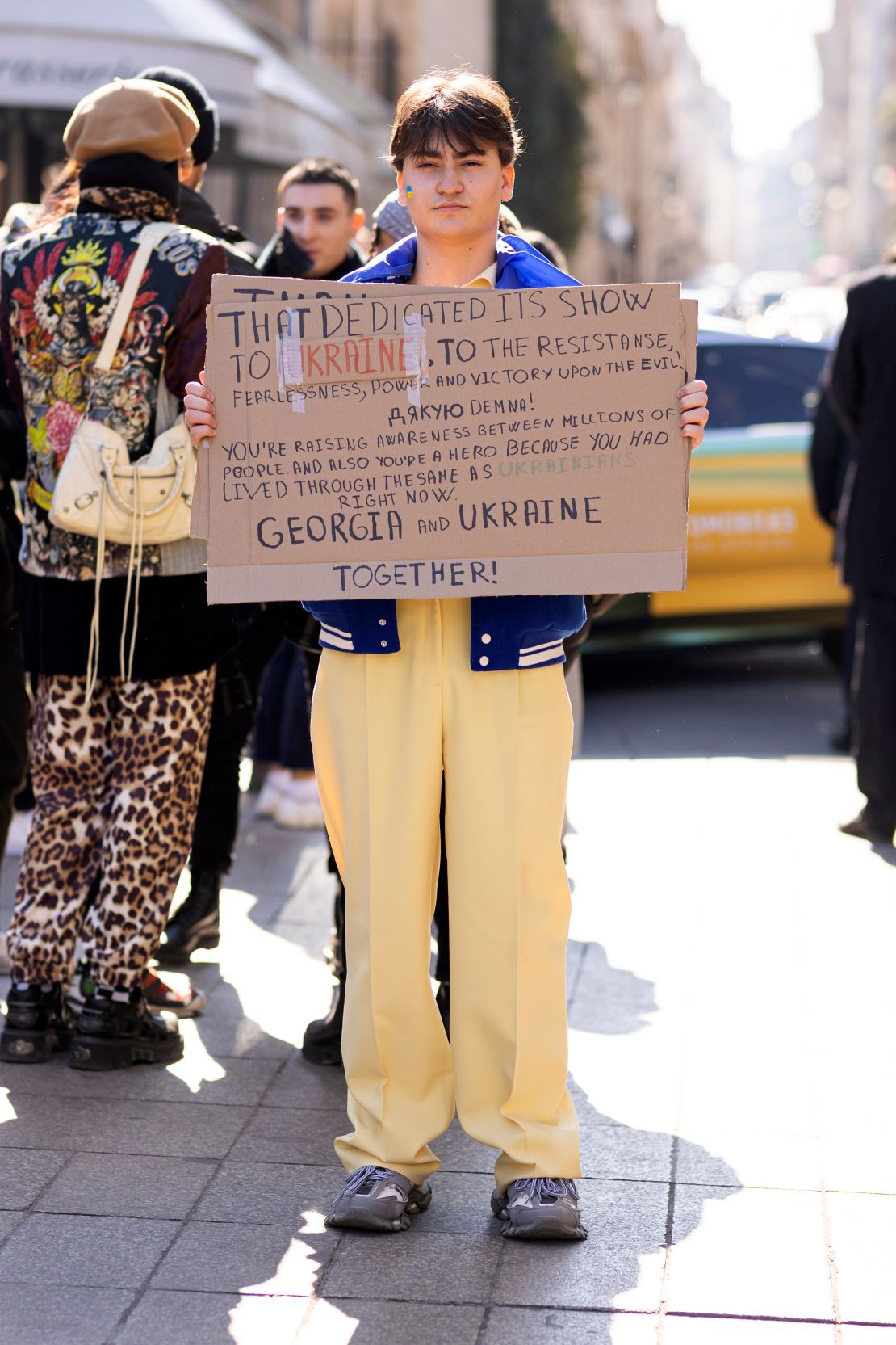 A few signs of ant-war protest were spotted outside shows during Paris Fashion Week.  