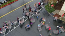 NOVATO, CALIFORNIA - MARCH 14: Hundreds of people line up to enter a Costco store on March 14, 2020 in Novato, California. Some Americans are stocking up on food, toilet paper, water and other items after the World Health Organization (WHO) declared Coronavirus (COVID-19) a pandemic. (Photo by Justin Sullivan/Getty Images)