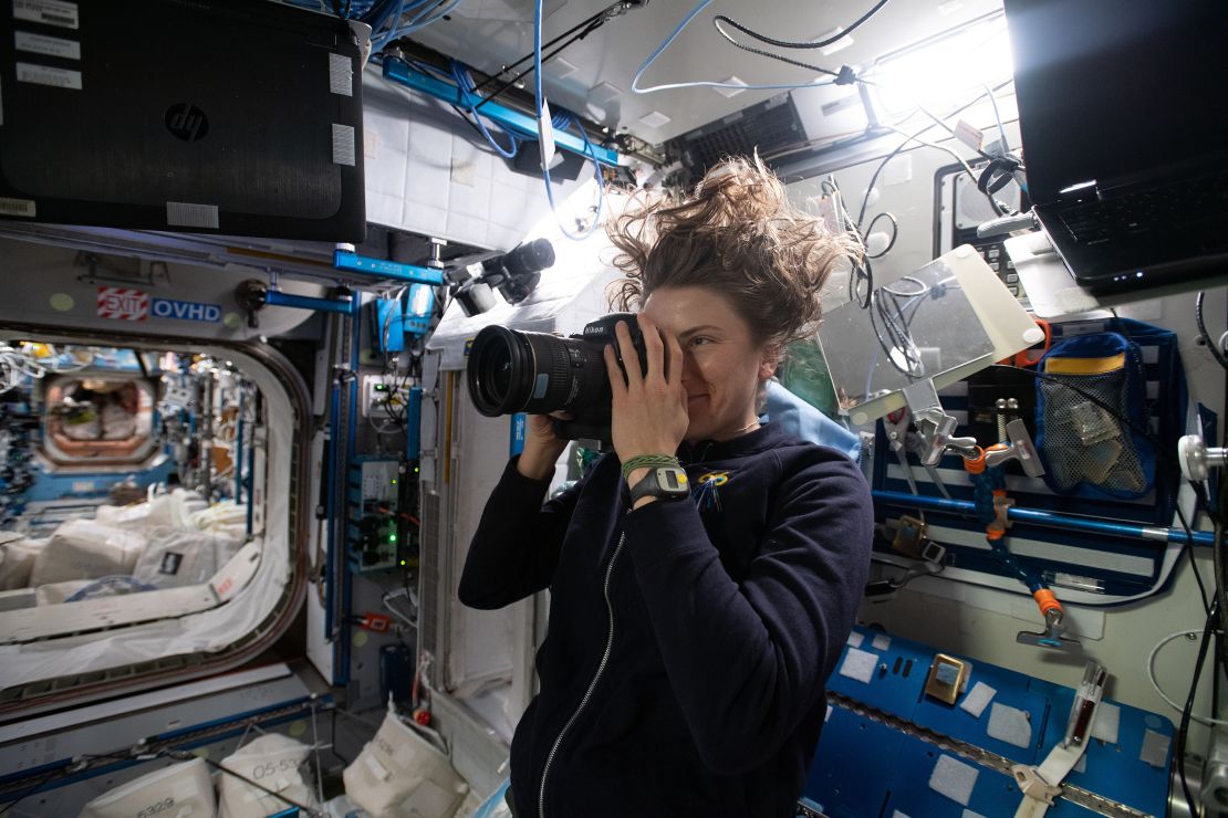 NASA astronaut Kayla Barron takes a photograph of the sample location in the US Node 2 module (Harmony) on the International Space Station for the Sampling Quadrangle Assemblages Research Experiment on January 15.
