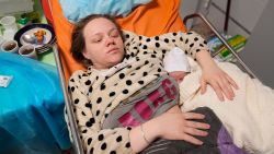 Mariana Vishegirskaya lies in a hospital bed after giving birth to her daughter Veronika, in Mariupol, Ukraine, Friday, March 11, 2022. Vishegirskaya survived the Russian airstrike on a children's and maternity hospital in Mariupol last Wednesday. 