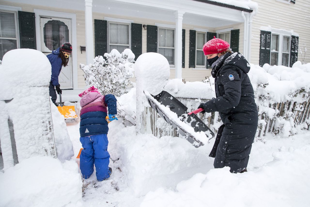 Bostonians help each other shovel snow in December 2020. Winter Storm Gail dumped snow, rain and sleet up and down the East Coast, but the aftermath was manageable with the aid of a kind neighbor. 
