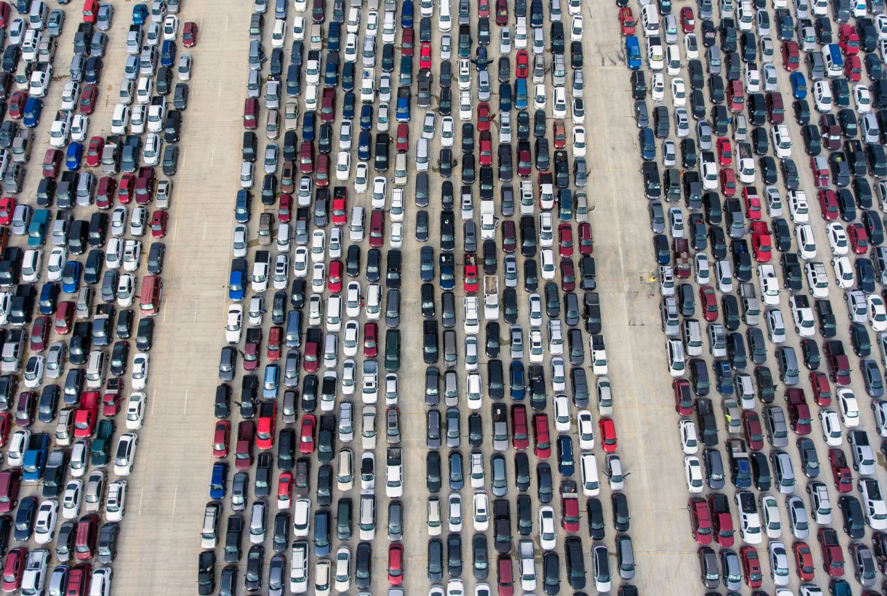 San Antonians wait in their cars for a local food bank to begin distributing food in April 2020. With millions of Americans unable to work during the pandemic, community organizations worked to provide food and other necessities to families unmoored by Covid-19.