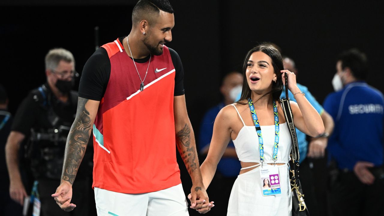 Nick Kyrgios walks with his girlfriend Costeen Hatzi after winning his men's doubles final with Thanasi Kokkinakis of Australia against Matthew Ebden of Australia and Max Purcell of Australia at the 2022 Australian Open at Melbourne Park.
