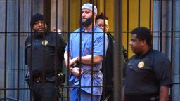 Officials escort "Serial" podcast subject Adnan Syed from the courthouse following the completion of the first day of hearings for a retrial in Baltimore, MD on Wednesday, Feb. 3, 2016. (Karl Merton Ferron/Baltimore Sun/Tribune News Service via Getty Images)