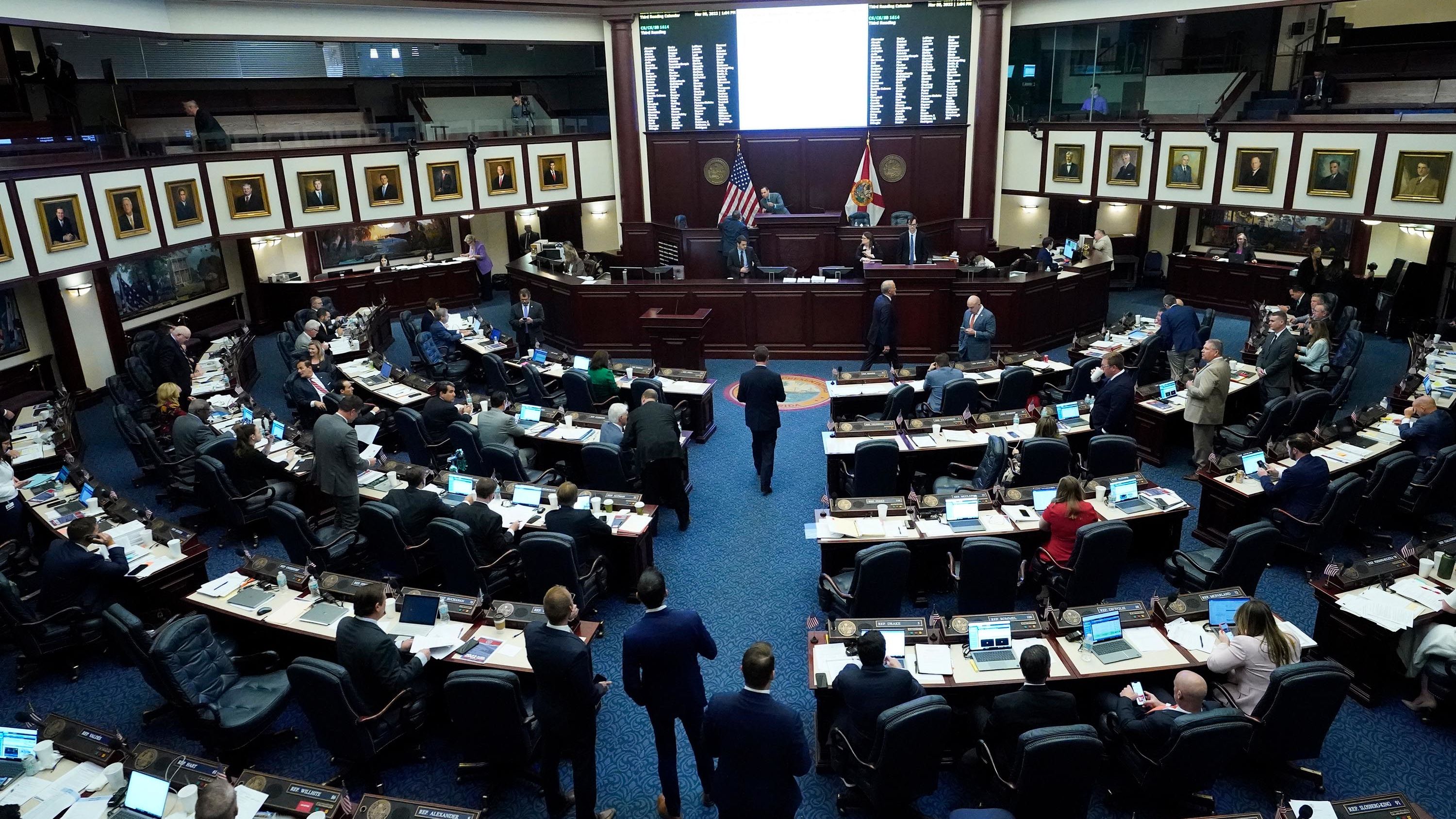 Florida state representatives work in the House during a legislative session at the state Capitol in Tallahassee, Florida, on March 8, 2022.