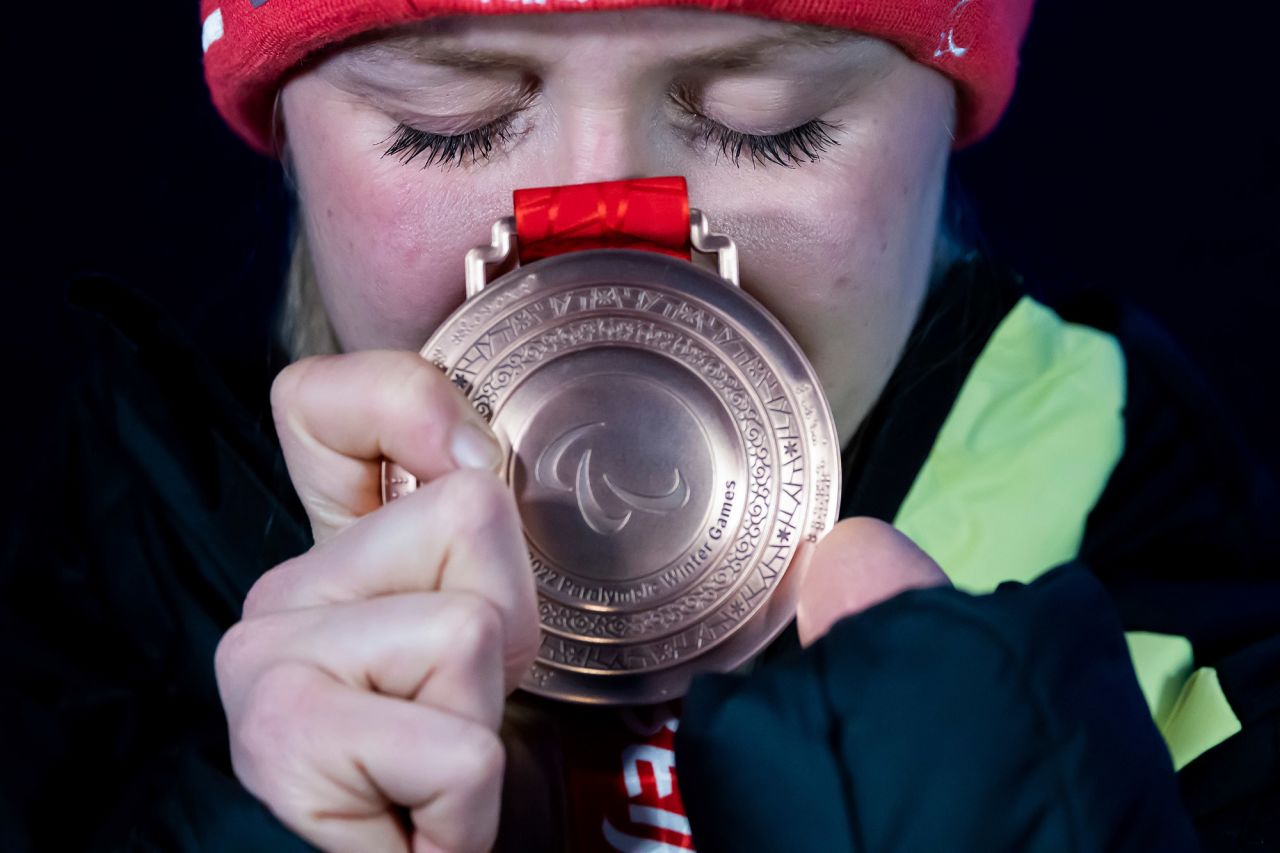 German skier Andrea Rothfuss holds her bronze medal after a giant-slalom event on March 11.