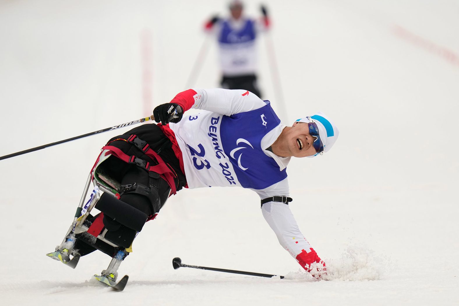 China's Zhu Yunfeng loses balance during a biathlon event on March 11.