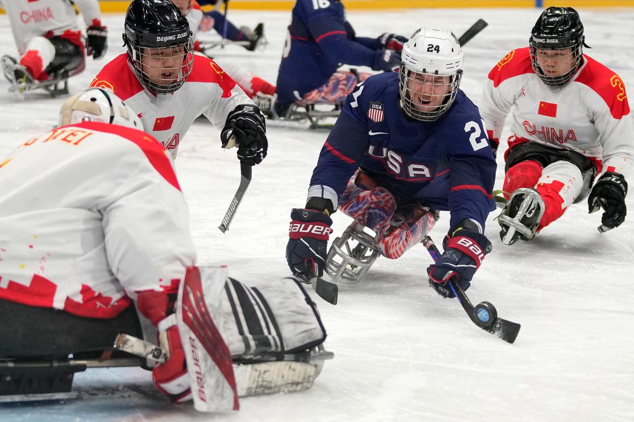 The United States' Joshua Misiewicz controls the puck during the semifinal against China on March 11.