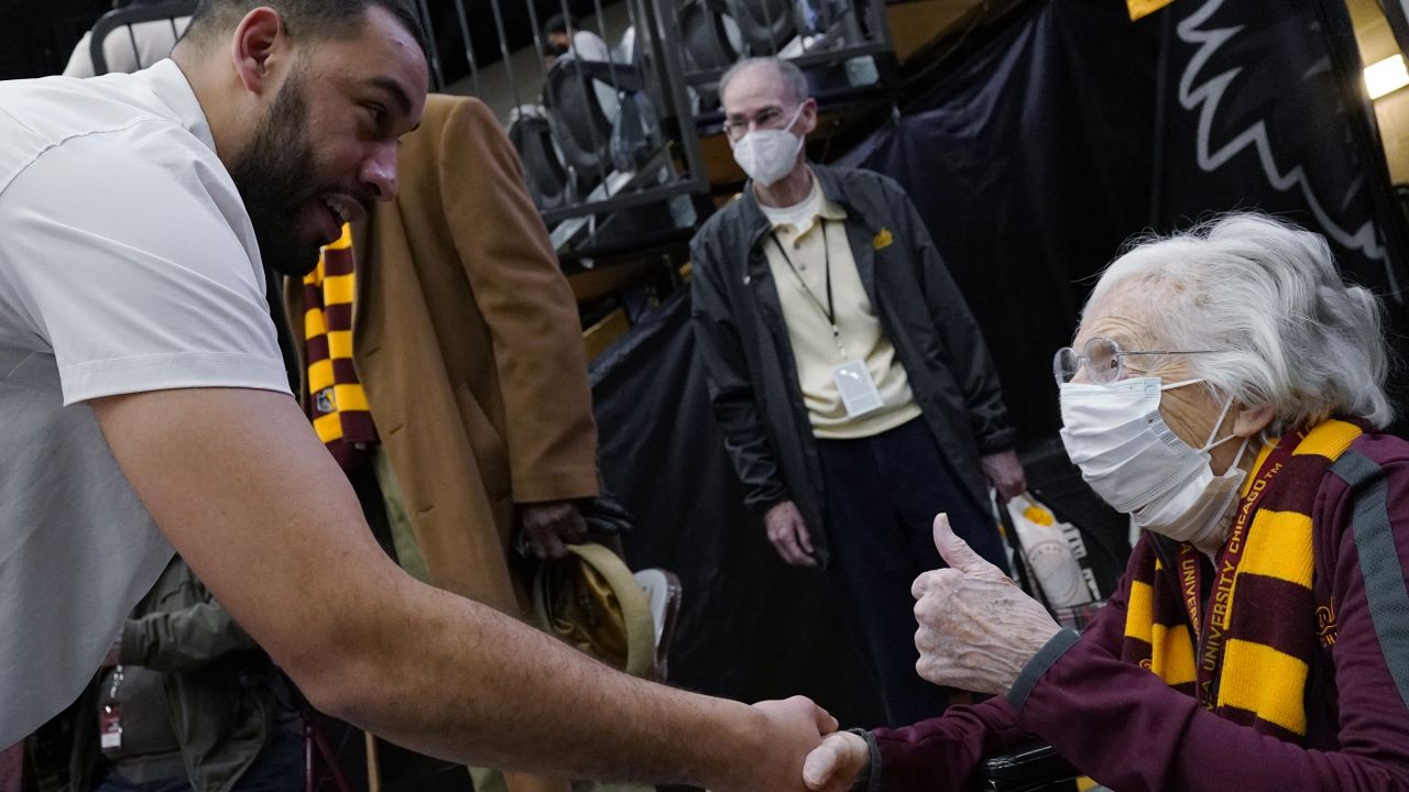 Sister Jean, chaplain for the Loyola Chicago men's basketball team, right, celebrates as she talks with head coach Drew Valentine after the team defeated Northern Iowa in an NCAA college basketball game in Chicago, Sunday, February 13, 2022.