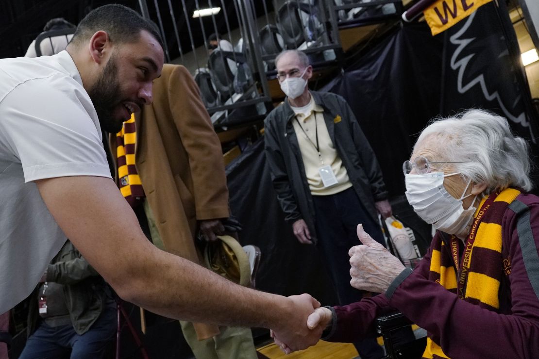 Sister Jean, chaplain for the Loyola Chicago men's basketball team, right, celebrates as she talks with head coach Drew Valentine after the team defeated Northern Iowa in an NCAA college basketball game in Chicago, Sunday, February 13, 2022.