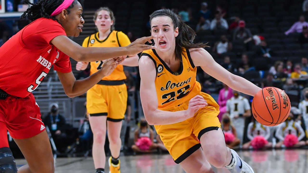 Caitlin Clark #22 of the Iowa Hawkeyes drives to the basket against MiCole Cayton #5 of the Nebraska Cornhuskers during the first half of a Women's Big Ten Tournament Semifinals game at Gainbridge Fieldhouse on March 05, 2022, in Indianapolis, Indiana.