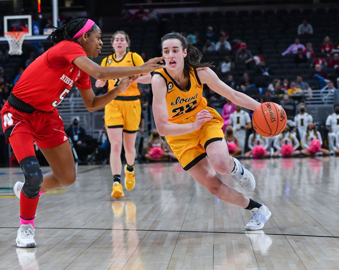 Caitlin Clark #22 of the Iowa Hawkeyes drives to the basket against MiCole Cayton #5 of the Nebraska Cornhuskers during the first half of a Women's Big Ten Tournament Semifinals game at Gainbridge Fieldhouse on March 05, 2022 in Indianapolis, Indiana.