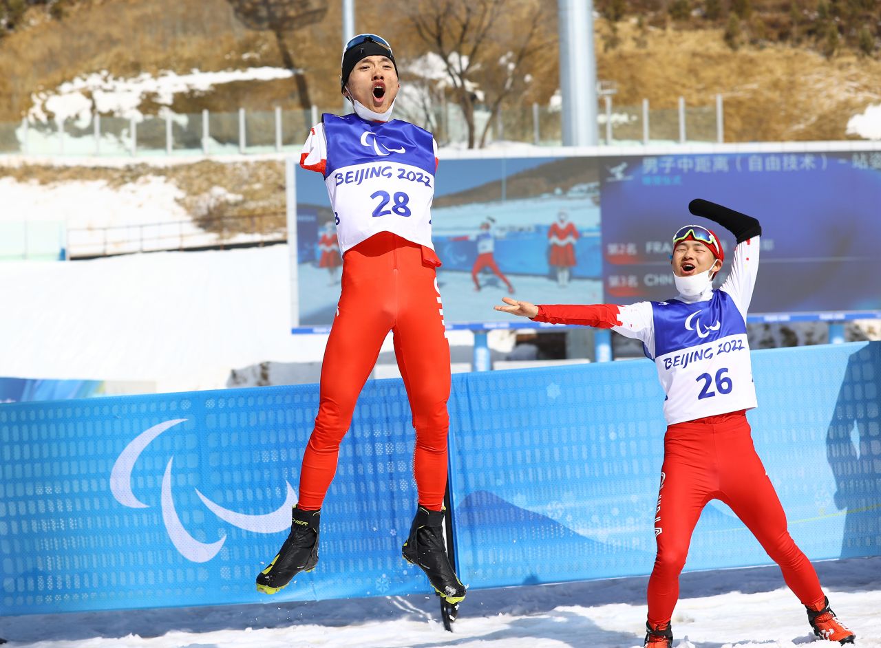 China's Wang Chenyang Wang and Cai Jiayun react after Wang won gold in a cross-country race on Saturday, March 12. Cai won silver.