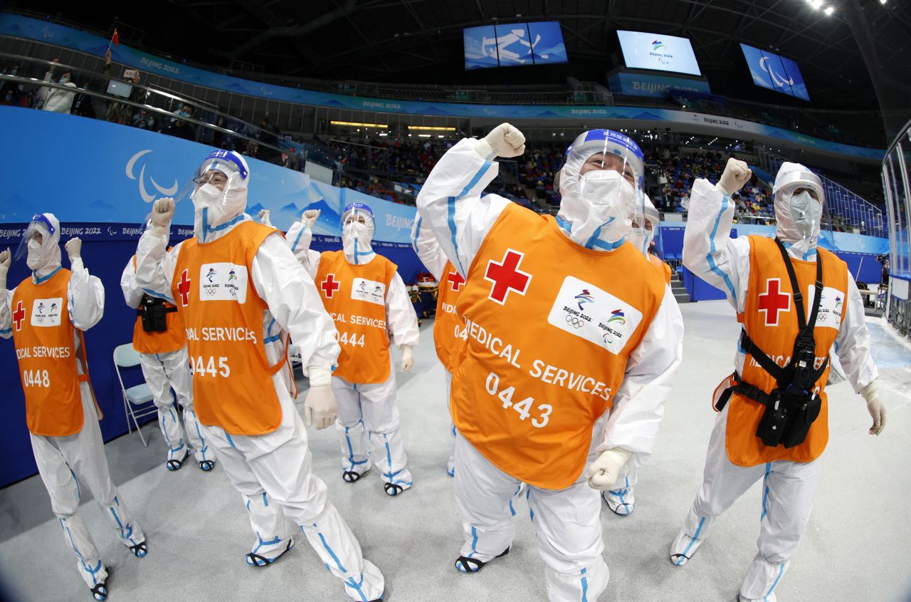 Members of the medical staff react during a hockey semifinal between China and the United States on Friday, March 11.