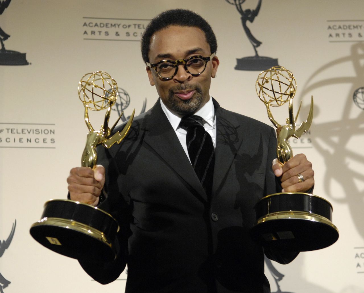Lee holds two directing awards he won at the 2007 Creative Arts Emmys.