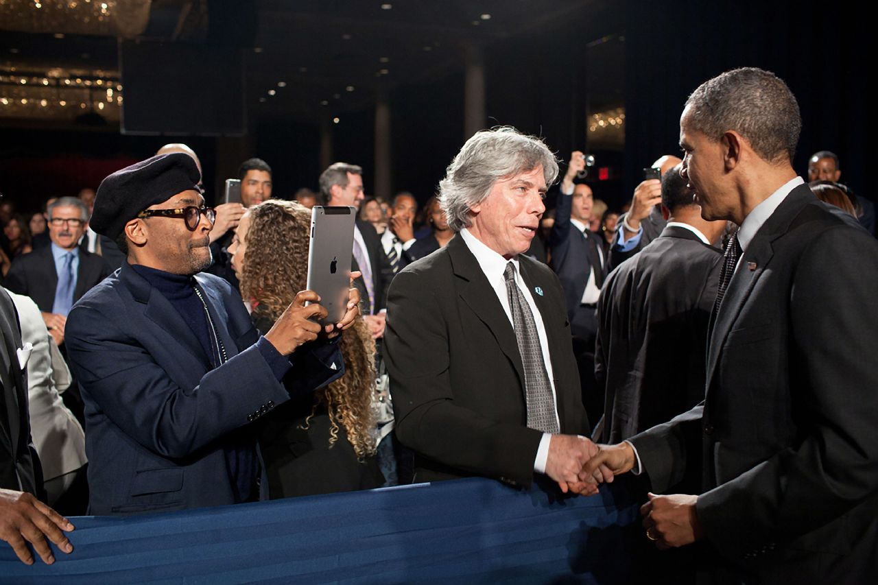 Lee uses an iPad to take a photo of President Barack Obama at an awards gala in New York in 2011.