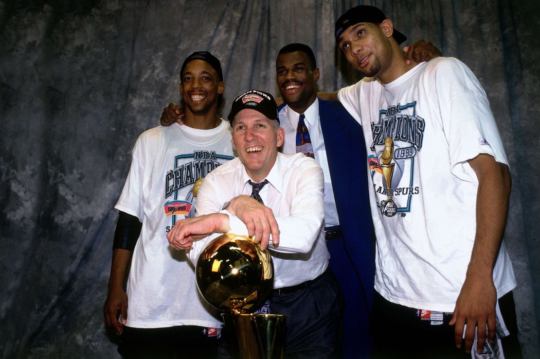 (L-R) Sean Elliot, head coach Popovich, David Robinson, and Tim Duncan of the San Antonio Spurs pose after winning the 1999 NBA Championship.