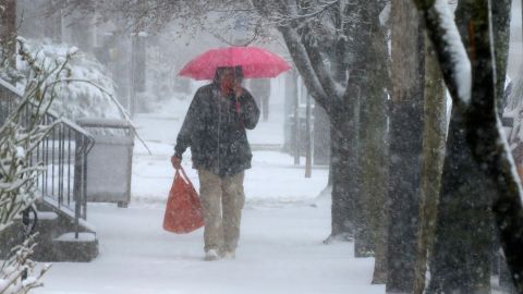 A man walks through Lancaster City, Pennsylvania, during Saturday's snowstorm.
