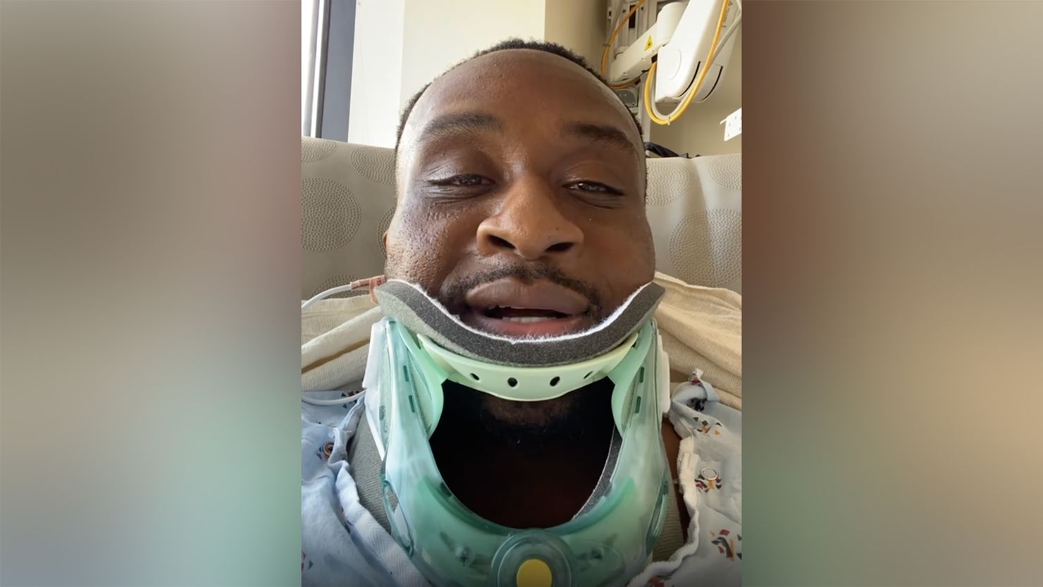 Big E wore a neck brace in a hospital bed in Birmingham Saturday.
