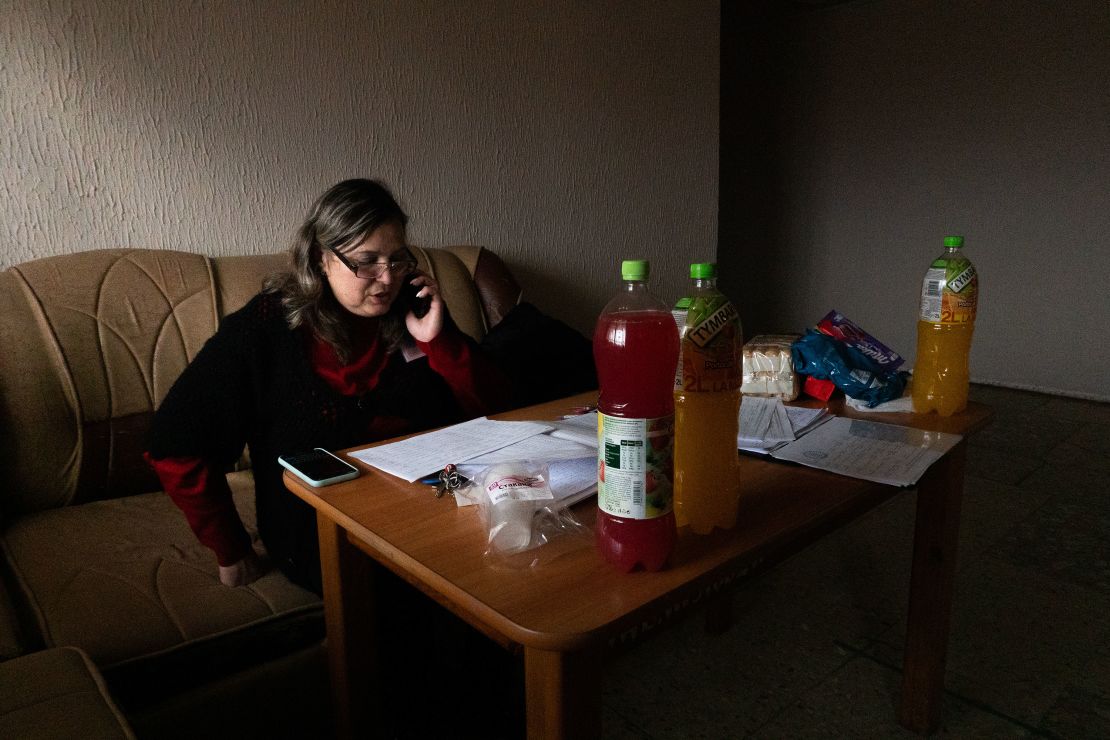 Elena Sierosa oversees a list of new arrivals at the shelter.