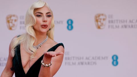Singer and actress Lady Gaga blows a kiss on the red carpet.