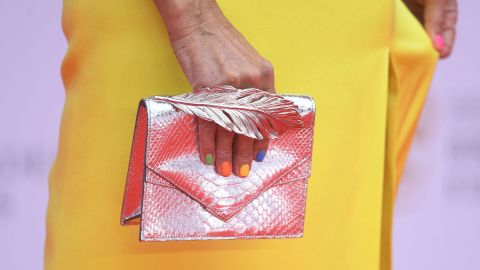 A close look at Jackie St. Clair's nails and bag on the red carpet.