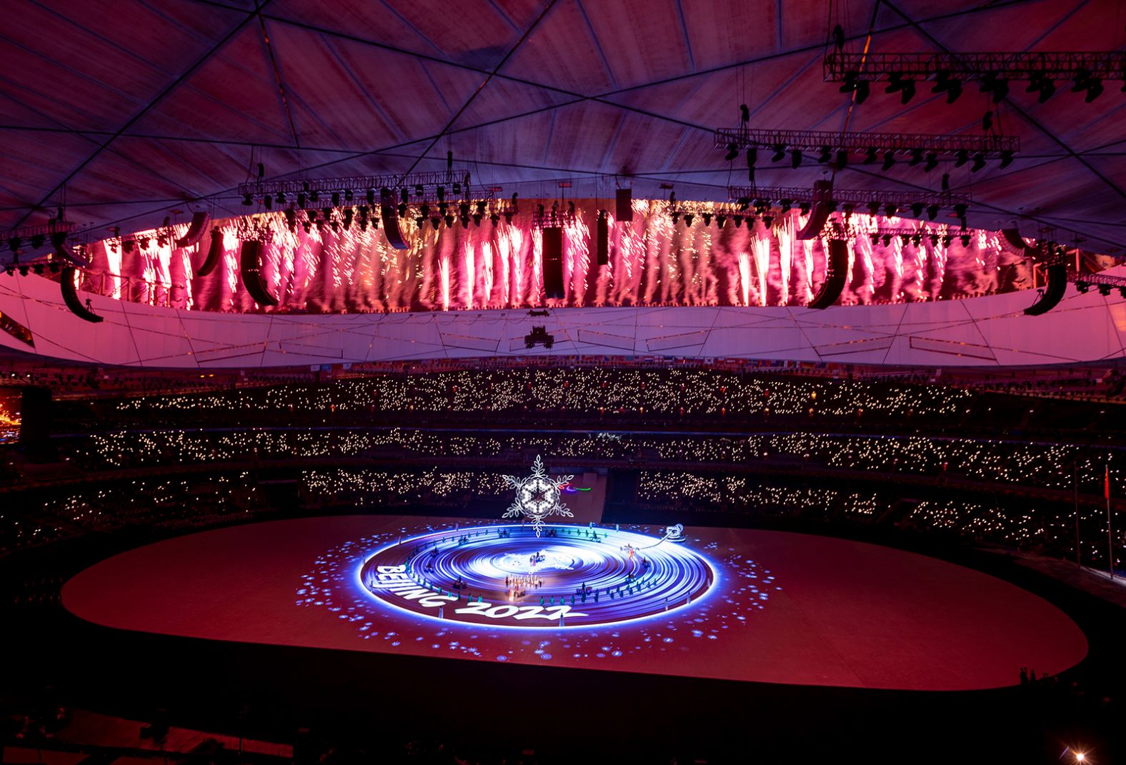 Fireworks glow above the Beijing National Stadium during the closing ceremony.