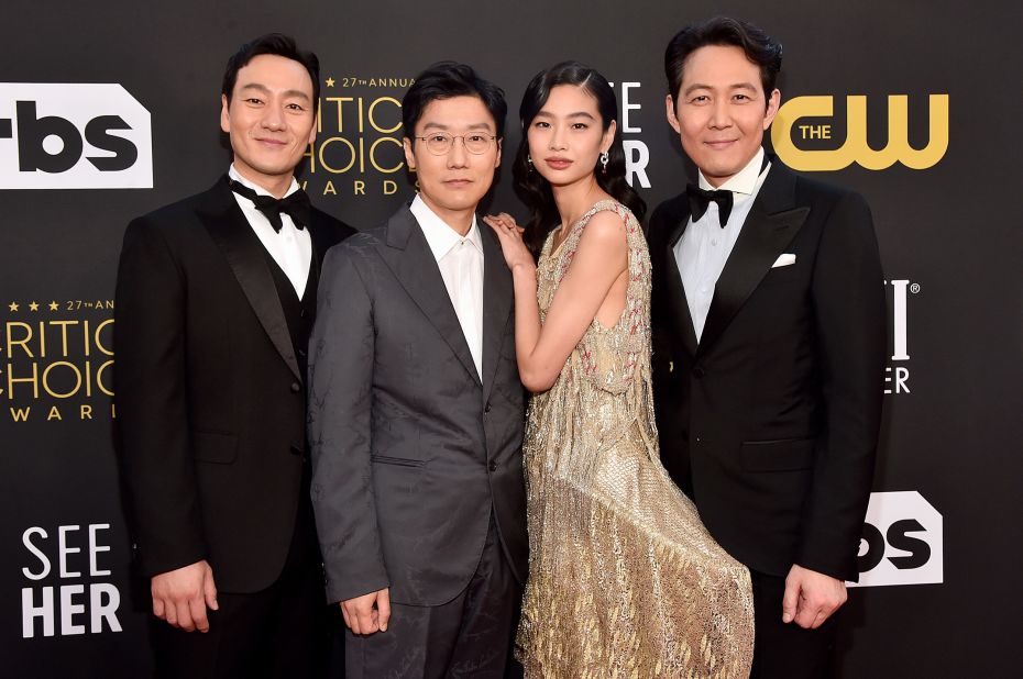 From left, "Squid Game" stars Lee Jung-jae, Hwang Dong-hyuk, Jung Ho-yeon and Park Hae-soo appear on the red carpet.