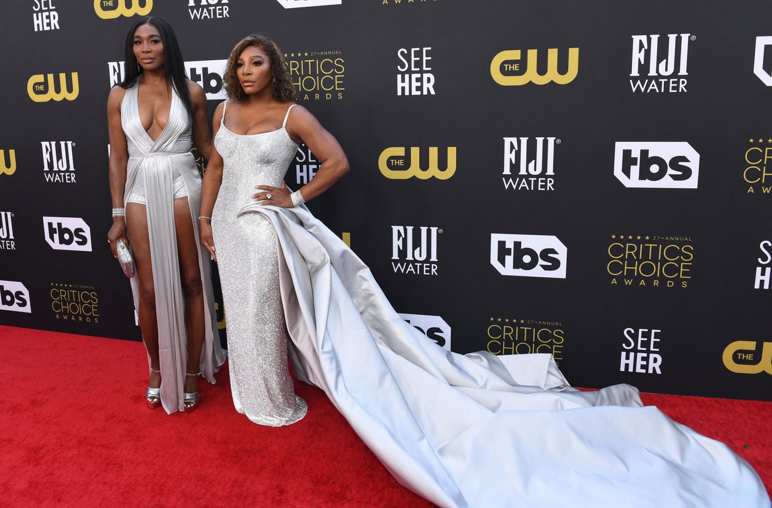 From left, tennis legends Venus and Serena Williams walk the red carpet.