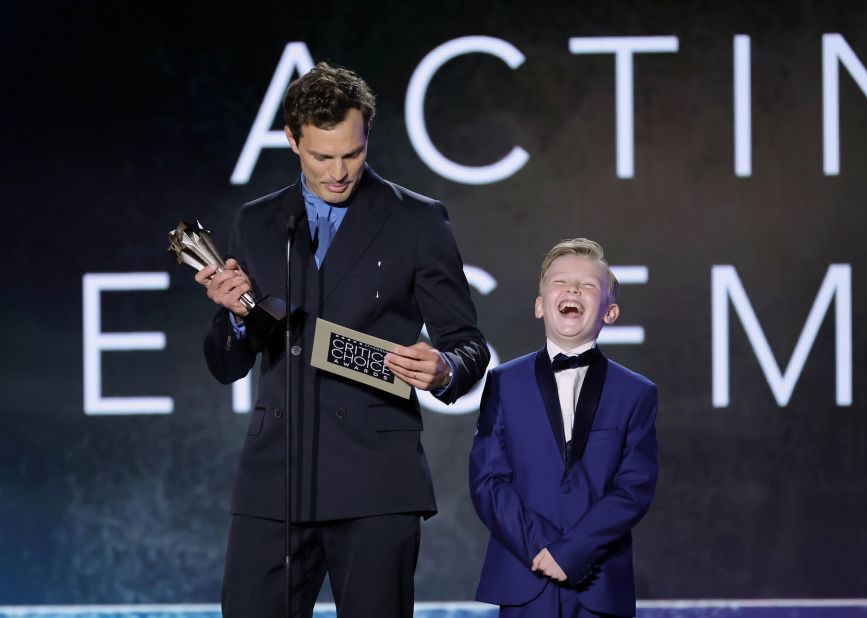 Jamie Dornan, left, and Jude Hill present an award. Hill also won the award for best young actor during the show.