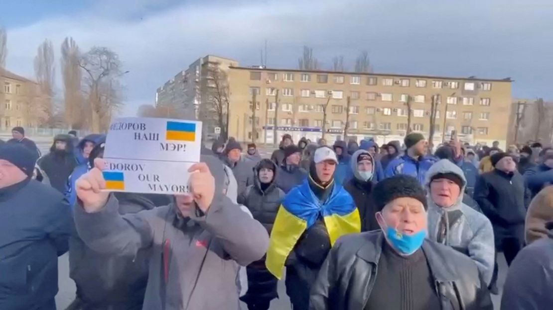 People protest the abduction of Mayor Ivan Fedorov, outside the Melitopol regional administration building, after he was reportedly taken away by Russian forces during their ongoing invasion, in Melitopol, Ukraine on March 12.