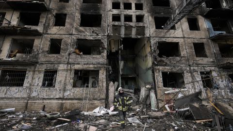 Damage is seen to an apartment building in Kyiv which was hit by shelling.